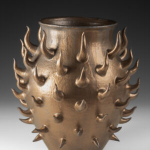 Thrown with hand built addition with metallic matt glaze