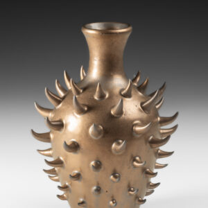 Thrown with hand built addition with metallic matt glaze